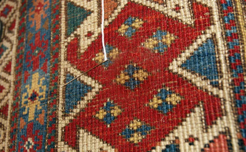 old russian kazak rug hole repair after