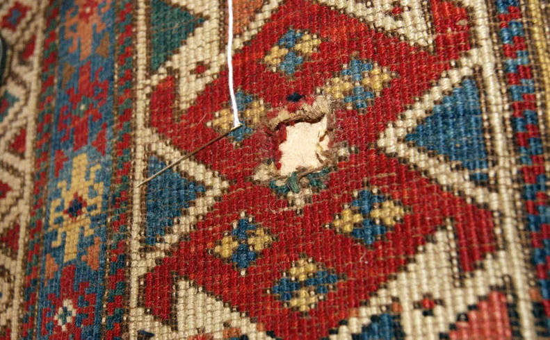 old russian kazak rug hole repair before